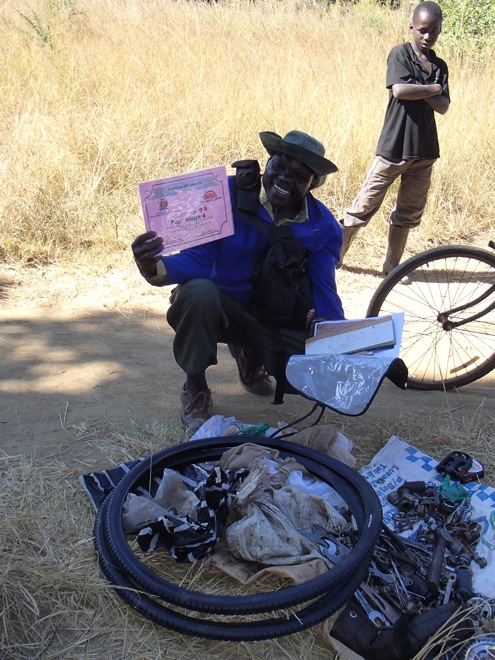 A field mechanic with his certificate